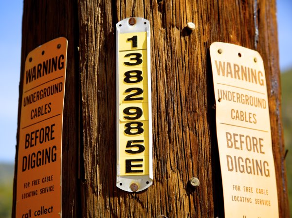 embossed tag on telephone pole